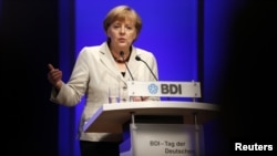 German Chancellor Angela Merkel gives a speech during the Federation of German Industries annual meeting in Berlin, September 25, 2012.