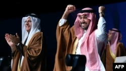 Asian Football Confederation President Sheikh Salman bin Ibrahim al-Khalifa, left, and Saudi Minister of Sports and Youth Abdulaziz bin Turki al-Faisal al-Saud celebrate after Saudi Arabia was confirmed as host of the 2034 World Cup, in Riyadh, Saudi Arabia, on Dec. 11, 2024.