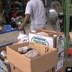 Workers box food items at the MANNA food center in Gaithersburg, Maryland