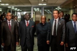 South African President Jacob Zuma (L), Zimbabwean President Robert Mugabe (2nd L), Lesotho Prime Minister Tom Thabane (C) and Botswana President Ian Khama (2nd R) stand for a group photo following an emergency meeting on the situation in Lesotho.