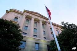 FILE - The Department of Justice headquarters building in Washington.