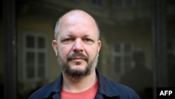 Matus Kostolny, editor-in-chief of Slovak newspaper Dennik N, poses during a photo session in downtown Bratislava, Slovakia, on May 18, 2024.