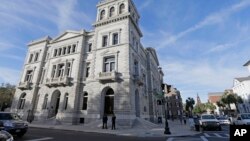 FILE - Officers with the Department of Homeland Security patrol outside the federal courthouse in Charleston, S.C., Nov. 7, 2016. Court documents suggest the judge thinks the man charged in the deaths of nine African-American churchgoers may not be mentally competent to stand trial.