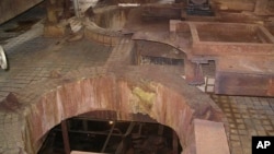 In this photo released by U.S. researchers who visited North Korea, pits from which dissolver tanks for uranium ore concentrate have been removed are seen at the Yongbyon Nuclear Center in North Korea, Feb. 14, 2008. 