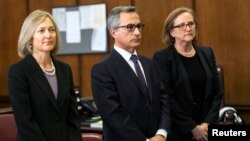 Georges Dirani (C), general counsel for BNP Paribas, appears with his lawyers in New York state court, June 30, 2014. The French bank pleaded guilty to violating U.S. sanctions laws.