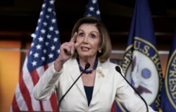 FILE - Speaker of the House Nancy Pelosi meets with reporters at her weekly news conference at the Capitol in Washington, Dec. 5, 2019.