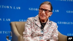 Supreme Court Justice Ruth Bader Ginsburg smiles as she takes questions from first-year students at Georgetown Law, Sept. 26, 2018, in Washington.