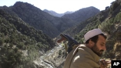 FILE - A soldier patrols the White Mountains near Tora Bora, Afghanistan, Dec. 18, 2001. 