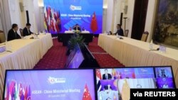 Vietnam's Deputy Prime Minister and Foreign Minister Pham Binh Minh chats in a video meeting with Chinese State Councillor Wang Yi and other leaders during the ASEAN-China ministerial meeting in Hanoi, Sept. 9, 2020. (ASEAN Vietnam 2020 via Reuters)