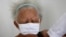 Justina Batista, 90, gets a shot of China's Sinovac vaccine in Brasilia, Brazil, Feb. 17, 2021.