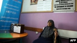 FILE - A refugee waits for a medical check in the UNRWA health center at the Asker refugee camp, near Balatah, east of Nablus, in the occupied West Bank, Sept. 1, 2018.