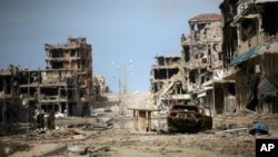 FILE - A general view of buildings ravaged by fighting in Sirte, Libya, Oct. 22, 2011, as the country's new leaders prepared to declare liberation after months of bloodshed that culminated in the death of longtime dictator Moammar Gadhafi. 
