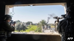 This handout picture released by the Israeli army on Jan. 23, 2024, shows Israeli soldiers operating in the Gaza Strip amid ongoing battles between Israel and the Palestinian militant group Hamas. (Photo by Israeli Army / AFP) 