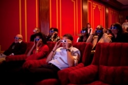 President Barack Obama and First Lady Michelle Obama in the White House theater on February 1, 2009.