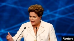Presidential candidate and Brazilian President Dilma Rousseff of Workers' Party (PT) speaks during the first television debate at the Bandeirantes TV studio in Sao Paulo, Aug. 26, 2014. 