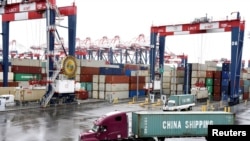 FILE - Containers are seen at the port in San Pedro, Calif., March 22, 2018.