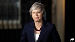 Britain's Prime Minister Theresa May delivers a speech outside 10 Downing Street in London, Nov. 14, 2018.