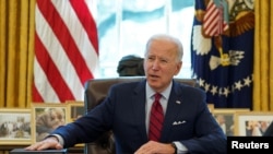 FILE - President Joe Biden speaks before signing executive orders at the White House in Washington, Jan. 28, 2021.