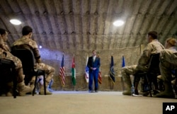 U.S. Defense Secretary Ash Carter talks to U.S. and Jordanian forces at a Jordanian air base, July 21, 2015.