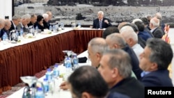 Palestinian President Mahmoud Abbas gestures as he speaks during a meeting with the Palestinian leadership in Ramallah, in the occupied West Bank, March 19, 2018.