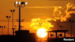 FILE - Sun rises over U.S. detention center Camp Delta at Guantanamo Bay Naval Base, Cuba, Oct. 18, 2012.