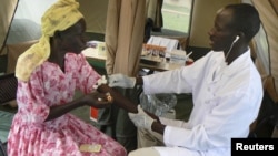 A woman is given a free HIV/AIDS test in Lira, northern Uganda, September 9, 2007. 