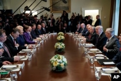 President Donald Trump speaks during a meeting with Baltic leaders in the Cabinet Room of the White House, April 3, 2018, in Washington.