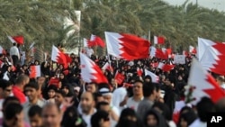 Anti-government protesters demonstrate, March 11, 2011, in Riffa, Bahrain, where a riot police barricade prevented tens of thousands of demonstrators from marching to the royal court