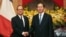 FILE - French President Francois Hollande (L) and his Vietnamese counterpart Tran Dai Quang shake hands at the Presidential Palace in Hanoi, Vietnam, Sept. 6, 2016.