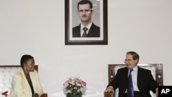 UN Under-Secretary-General for Humanitarian Affairs and Emergency Relief Coordinator, Valerie Amos, meets with Faisal Mekdad Syrian Ambassador to UN, during a press conference in Damascus, Syria, August 14, 2012.