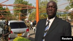 South Sudan's Defence Minister Kuol Manyang Juuk, poses for a photo after a cabinet meeting in Juba January 17, 2014. 