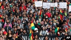 Anti-government protesters demand a runoff in the presidential election, in La Paz, Bolivia, Oct. 24, 2019. Evo Morales declared himself the winner of a fourth term, enraging his opponents who alleged vote fraud and demanded a second round of voting.