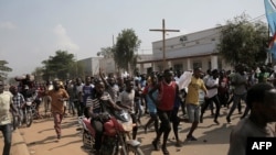 Plusieurs centaines de personnes ont manifesté pour protester contre le report des élections, à Beni, le 27 décembre 2018.