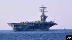 FILE - The American nuclear-powered aircraft carrier USS Dwight D. Eisenhower is seen in a July 14, 2012, photo.
