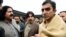 FILE - In this Jan. 27, 2020, photo, leaders of the Pashtun Tahafuz (Protection) Movement or (PTM), Mohsin Dawar, right, and Ali Wazir, left, protest the arrest of their leader in Islamabad, Pakistan.
