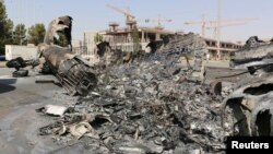 A wreckage of a burnt aircraft is pictured after a shelling at Tripoli International Airport in Tripoli, Libya, July 21, 2014. 