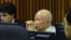 Khieu Samphan, center, former Khmer Rouge head of state, sits in a court room of the U.N.-backed war crimes tribunal, in Phnom Penh, Jan. 8, 2015.