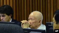 FILE - Khieu Samphan, center, former Khmer Rouge head of state, sits in a court room of the U.N.-backed war crimes tribunal, in Phnom Penh, Jan. 8, 2015.