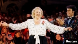 FILE - Dame Vera Lynn receives applause from the audience during a concert commemorating the 50th anniversary of the end of the second world war in Europe, in Hyde Park in London, Britain, May 6, 1995.