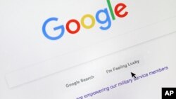 A cursor moves over Google's search engine page on Aug. 28, 2018, in Portland, Ore.