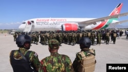 FILE - Kenyan police officers arrive at the Toussaint Louverture International Airport in Port-au-Prince, Haiti, as part of a peace-keeping mission to tackle violence in Haiti, Jan. 18, 2025. 