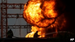 Rescue workers extinguish a fire of a burning electrical substation hit by a Russian bombing in Dnipropetrovsk region, Ukraine, Sept. 2, 2024.