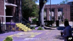 FILE - A Benedict College courtyard is nearly empty, April 3, 2020, in Columbia, S.C. Officials at the historically black college expect to lose $2 million in housing refunds from a $52 million budget due to constraints tied to the coronavirus outbreak.