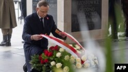 Poland's President Andrzej Duda lays a wreath of flowers at the Tomb of the Unknown Soldier during the ceremonies for Poland's Independence Day, Nov. 11, 2024, in Warsaw.
