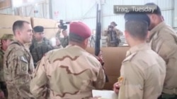 US-led Coalition Gives Some Weapons to Iraqi Troops