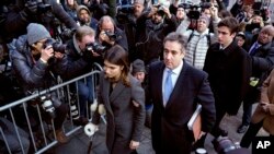 Michael Cohen, center, President Donald Trump's former lawyer, accompanied by his children Samantha, left, and Jake, right, arrives at federal court for his sentencing in New York, Dec. 12, 2018.