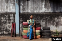 Singer Temi Dollface poses for a picture in the compound where she works from, in the Ikeja district of Lagos, Nigeria, May 18, 2016.
