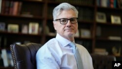 FILE - Judge Juan M. Merchan sits for a portrait in his chambers in New York, March 14, 2024.