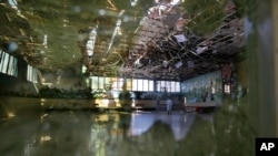 Damage of the Dubai City wedding hall is seen after an explosion in Kabul, Afghanistan, Sunday, Aug. 18, 2019. 