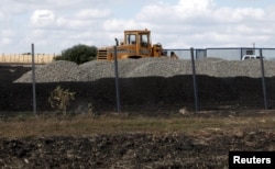 An excavator is seen at a construction site for Russia's new military base near the Russian-Ukrainian border in the village of Soloti, southeast of Belgorod, Russia, Sept. 7, 2015.